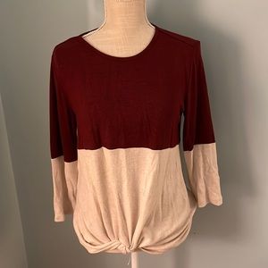 Super soft scoop neck sweater with tie at the waist.
